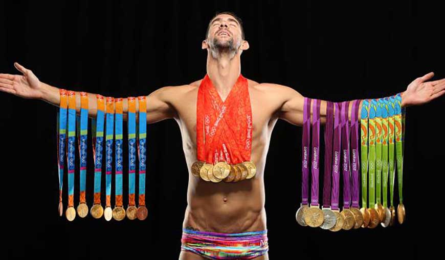 Michael Phelps con sus medallas olímpicas